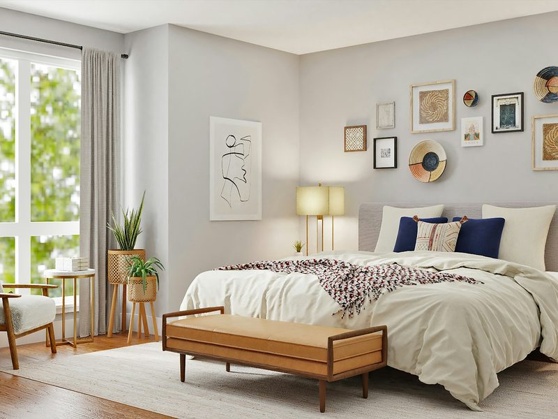 A comfortable bedroom with a made bed and natural light